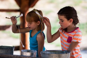 kids making candles at camp