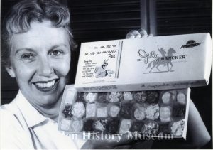 woman holding box of chocolates