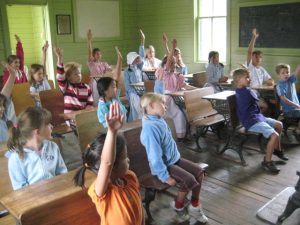 children in schoolhouse