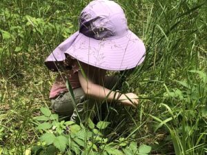 girl looking at plants