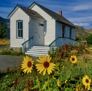 flowers in front of schoolhouse